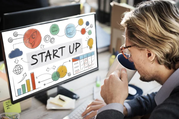 Businessman working on computer with start up — Stock Photo, Image