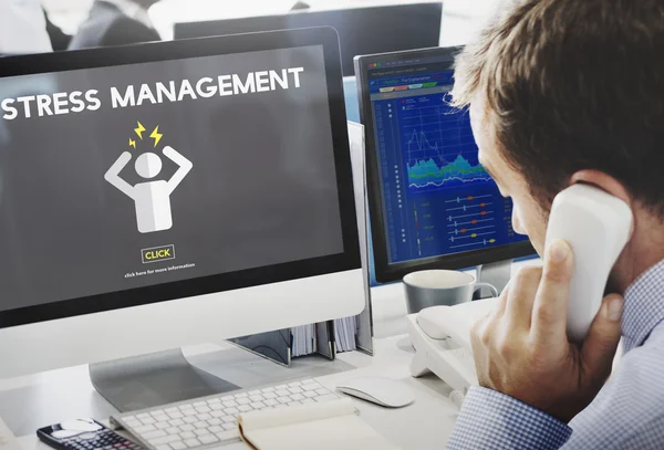 Businessman working on computer with stress management — Stock Photo, Image