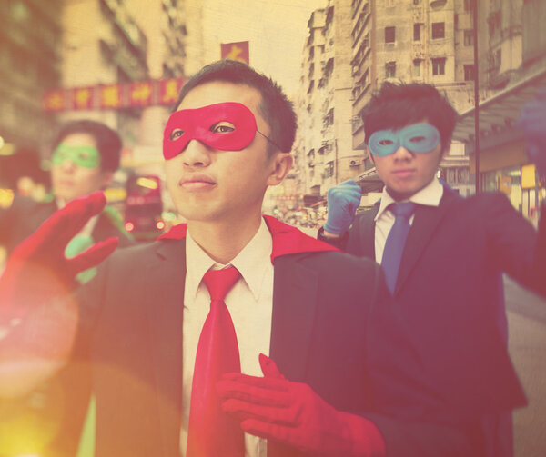 businessmen in superhero masks  