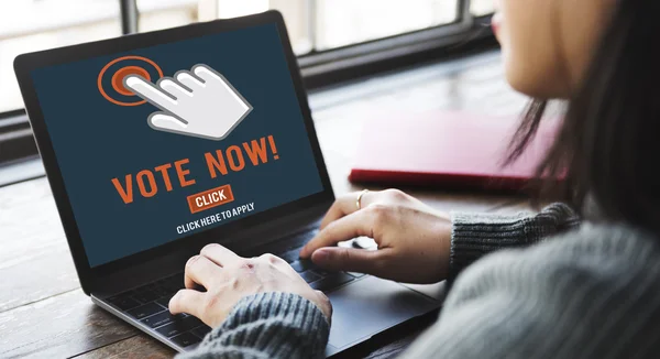 Woman typing on laptop with Vote Now — Stock Photo, Image