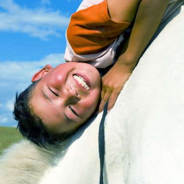 Mongolian boy on horse clipart