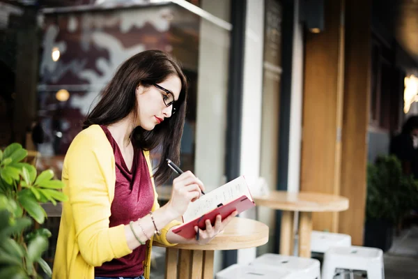 Woman Writing in Cafe — Stock Photo, Image