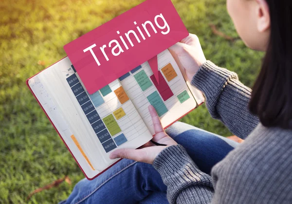 Woman reading book and training — Stock Photo, Image