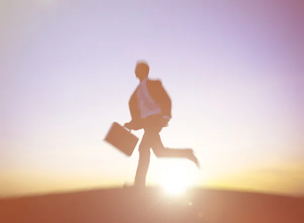 Silhouette of Businessman running — Stock fotografie