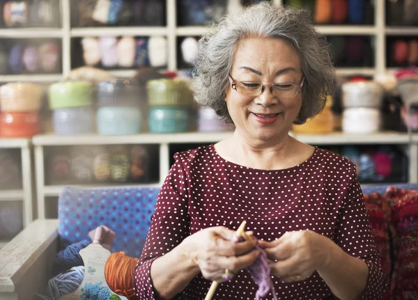 Grandma crocheting Concept — стоковое фото