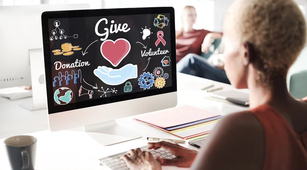 Business woman working on computer with give donation — стоковое фото