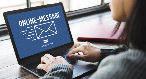 Woman typing on laptop with Online Message — Stock Photo, Image