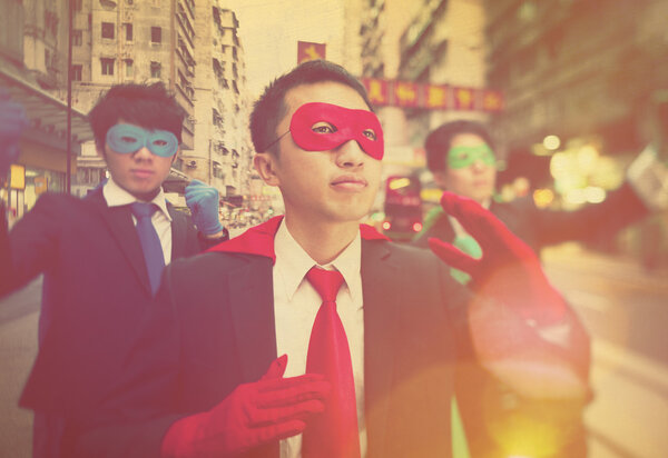 businessmen in superhero masks  