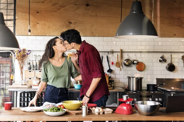 portrait of happy couple in kitchen
