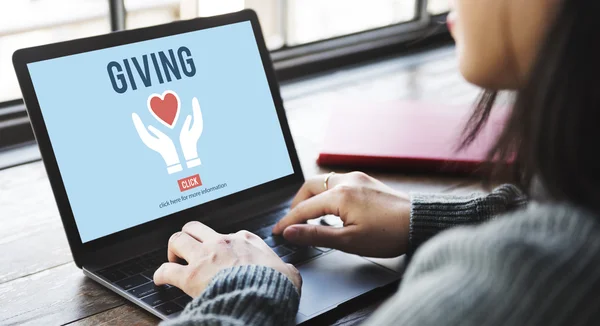 Woman typing on laptop with giving — Stock Photo, Image