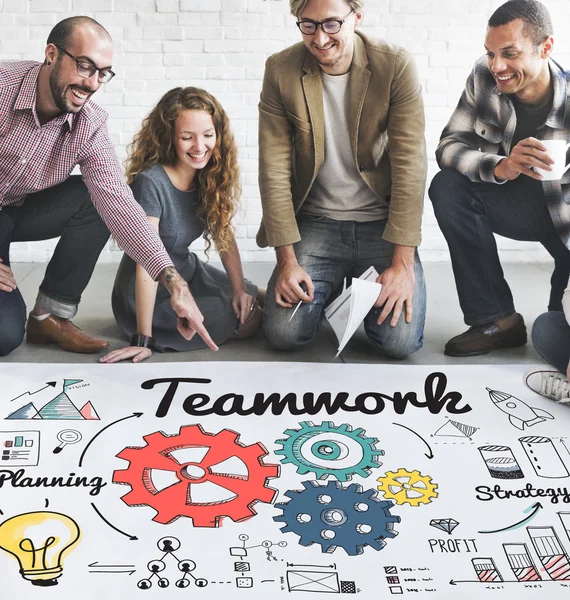 Designers working with poster and teamwork — Stock Photo, Image