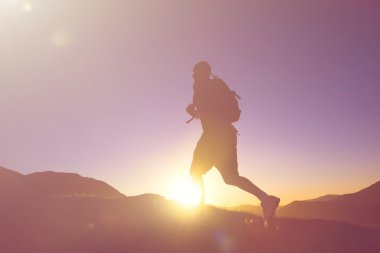 Man jogging in Mountains clipart