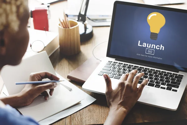 woman working on laptop with launch