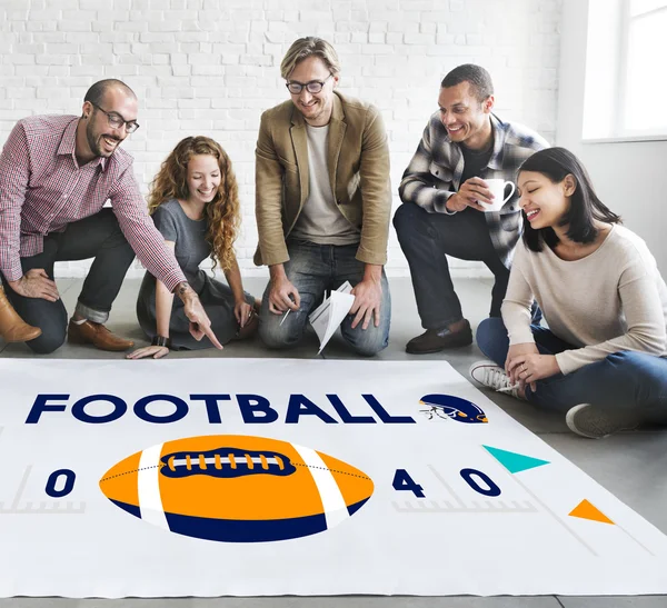 Designers travaillant avec poster et football — Photo