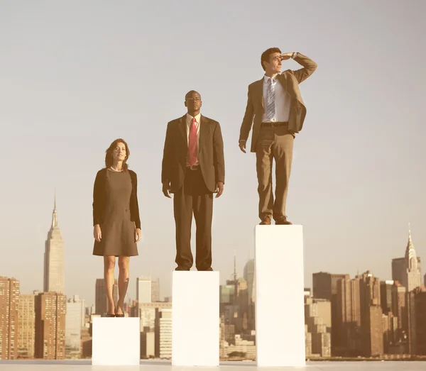 Business people standing on growth chart — Stock Photo, Image