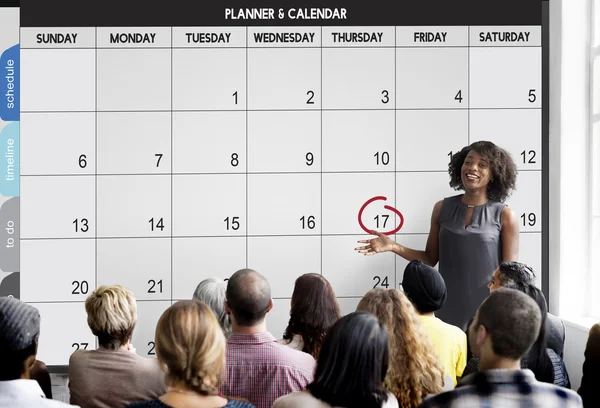 Lidé na semináři s kalendářem — Stock fotografie