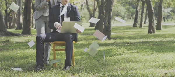 business people posing in nature