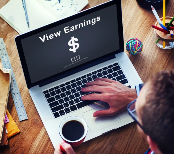 Man using laptop and View Earnings — Stock Photo, Image