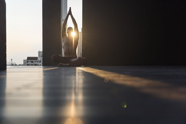 active man practicing yoga