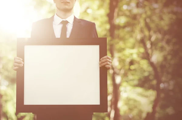 Businessman Holding Picture — Stock Photo, Image