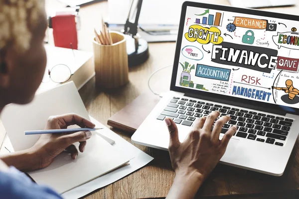 Woman working on laptop with finance — Stock Photo, Image