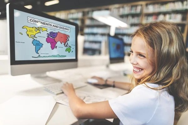 Cute girl using computer — Stock Photo, Image