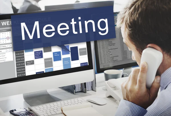 Businessman working on computer with meeting — Stock Photo, Image