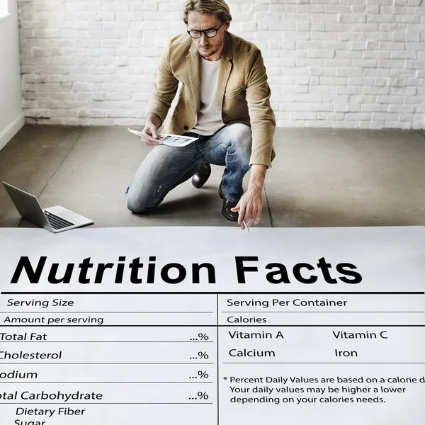 Businessman working with Nutrition Facts — Stock Photo, Image