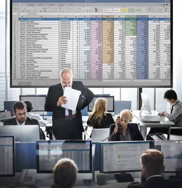 Business workers and spreadsheet — Stock Photo, Image