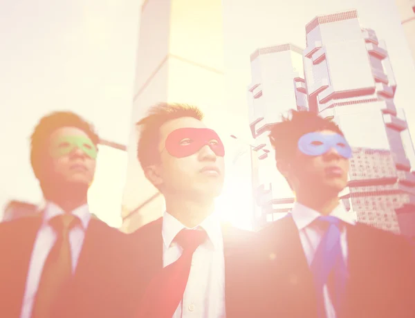 Businessmen in superhero masks — Stock Photo, Image