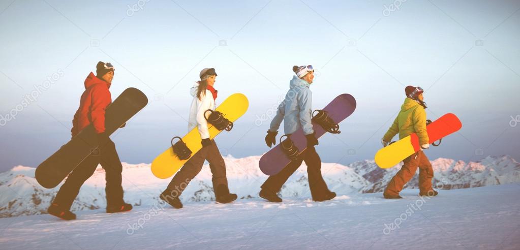 Snowboarders on top of mountain