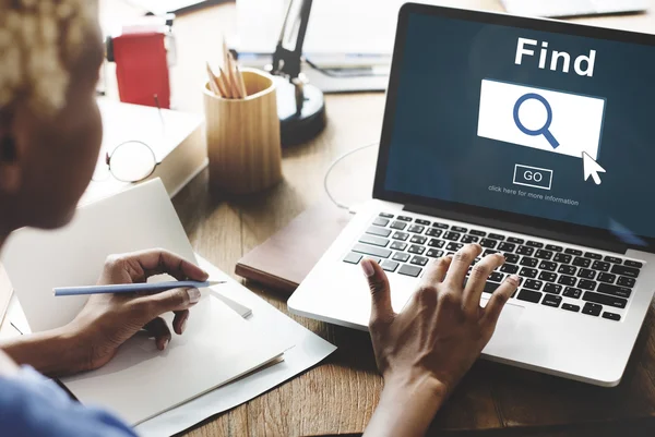 Woman working on laptop with finder — Stock Photo, Image