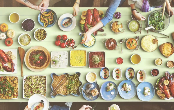 Friends eating for big table — Stock Photo, Image