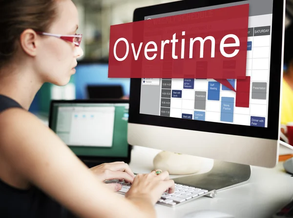 Businesswoman working on computer with overtime — Stock Photo, Image