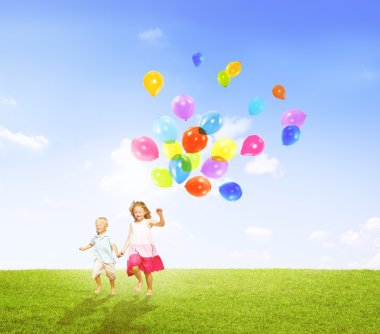 Little Girl and Boy Holding Balloons clipart