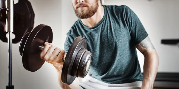 Sportsman doing Athletic exercise — Stock Photo, Image