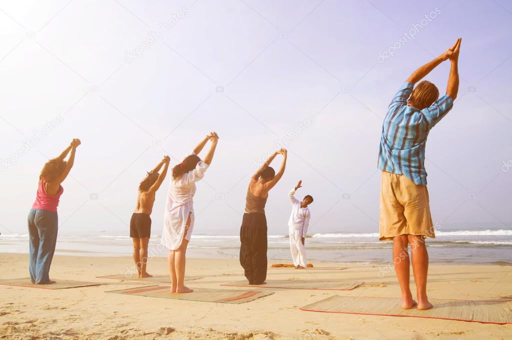people doing exercise of yoga