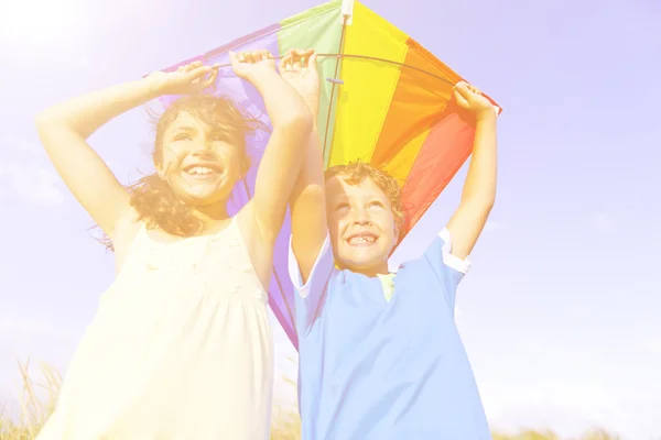 Cheerful Children Playing with Kite — Stockfoto