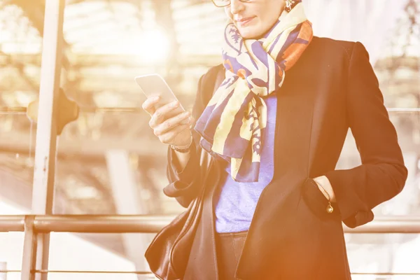 Businesswoman with digital device — Stock Photo, Image