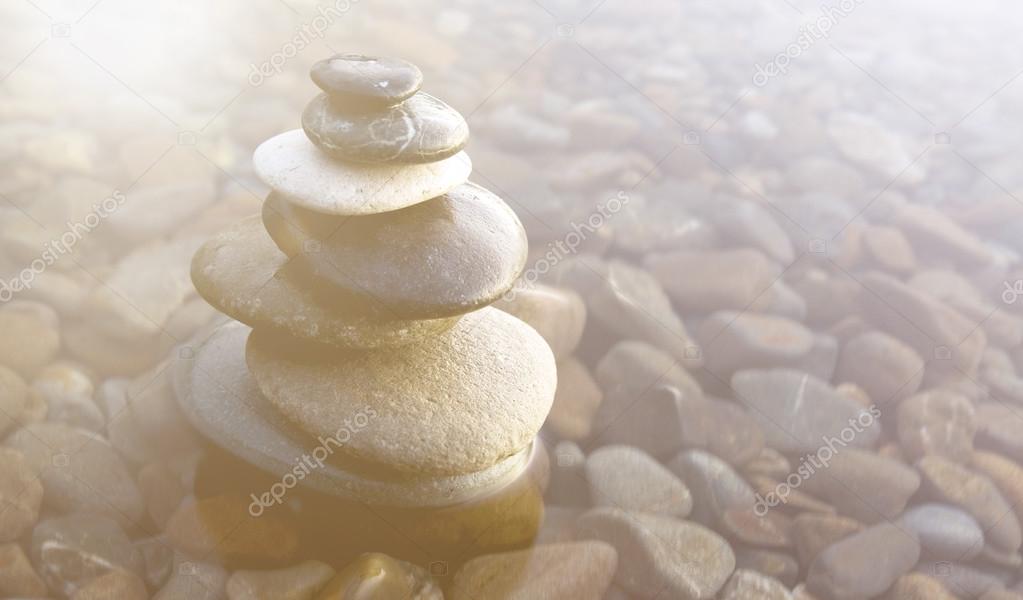 Balancing Pebbles Covered with Water