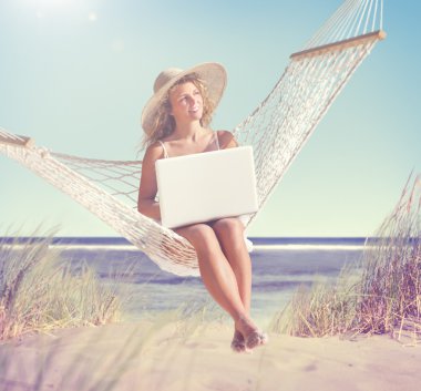 Woman relaxing on beach clipart
