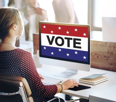 businesswoman working on computer with vote clipart