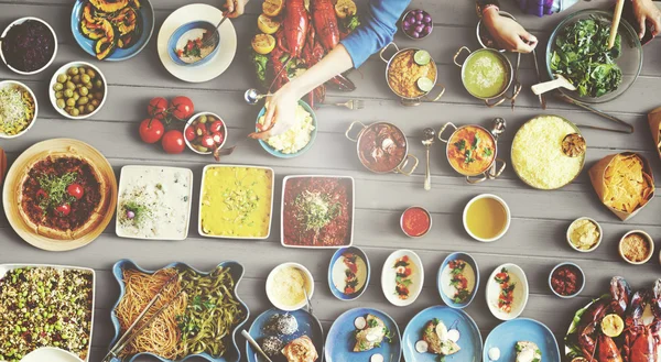 Friends eating for big table — Stock Photo, Image