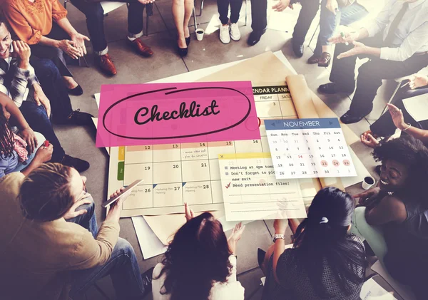 People over poster with checklist — Stock Photo, Image