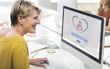 Woman using computer in the office  clipart