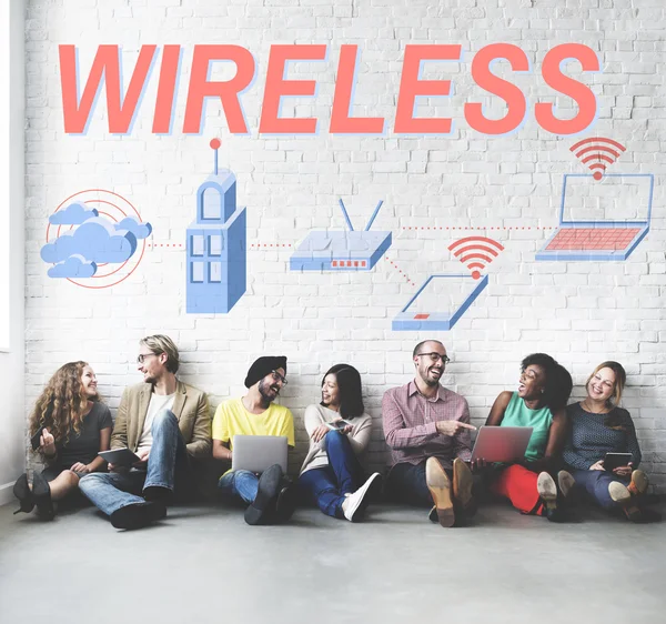 Diversity friends near wall with wireless — Stock Photo, Image