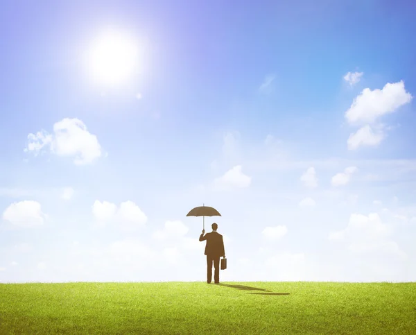 Business man in suit holding umbrella — Stock Photo, Image