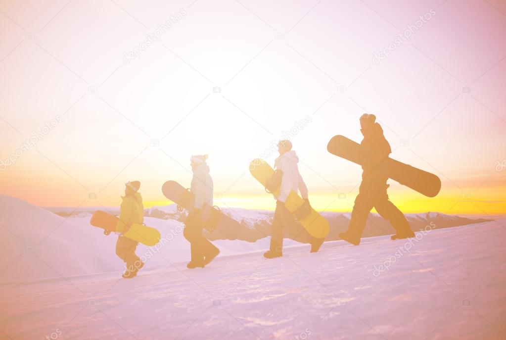 Snowboarders on top of mountain