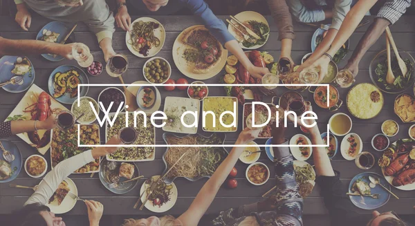 People and food with Wine And Dine — Stock Photo, Image