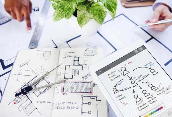 Workplace table with architect blueprints — Stock Photo, Image